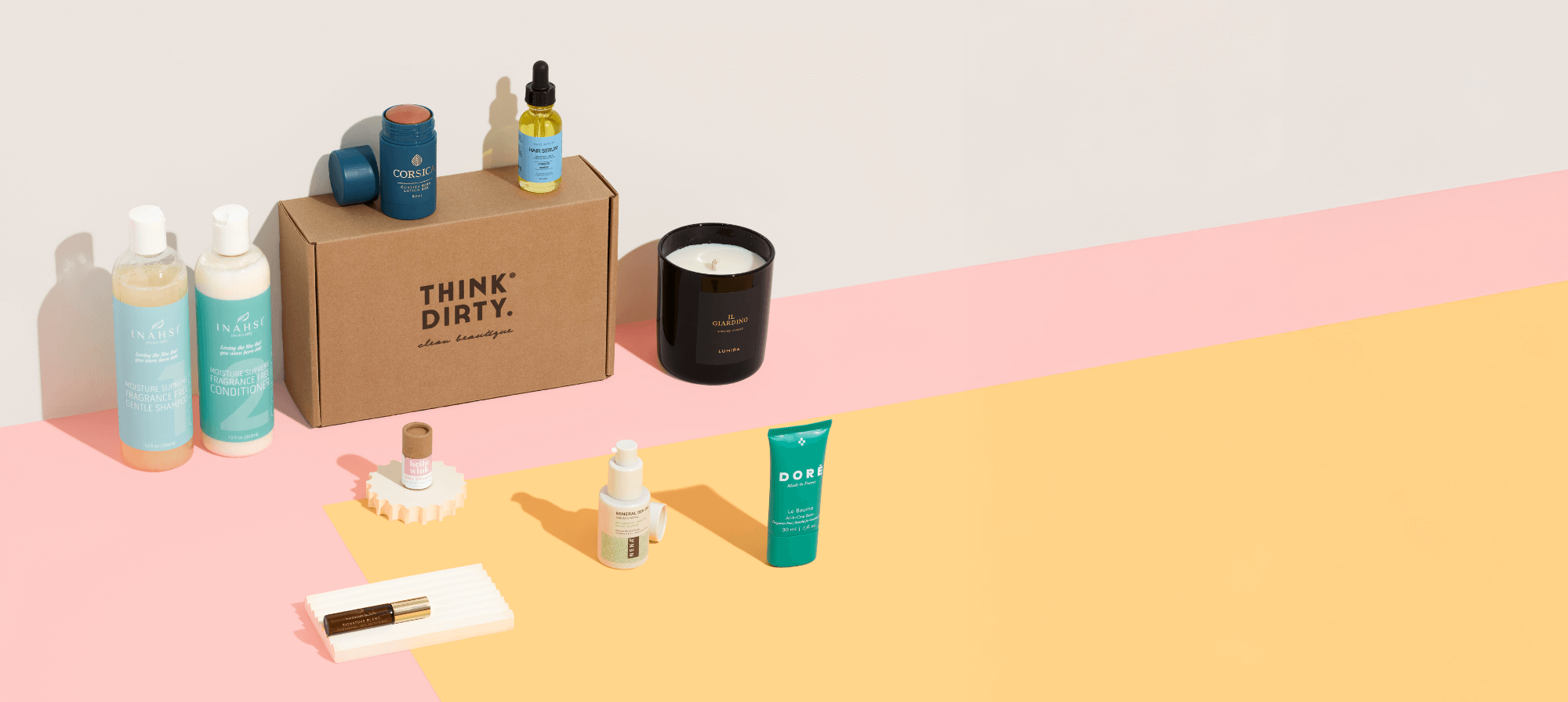 Think Dirty Monthly Box - Clean Beauty and Eco-Friendly Essentials Think Dirty Monthly Box with clean beauty and eco-friendly products including styling gel, hydrating serum, eye gels, bar soap, lipstick, laundry detergent sheets, and shower steamers.