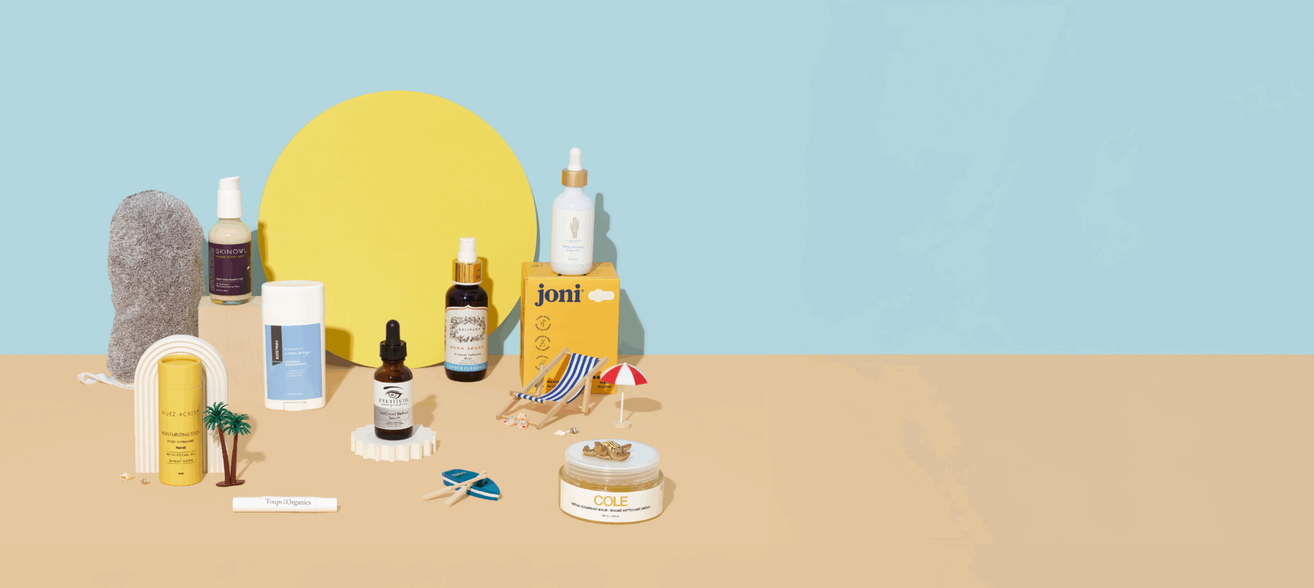 Think Dirty Monthly Box - Clean Beauty and Eco-Friendly Essentials Think Dirty Monthly Box with clean beauty and eco-friendly products including styling gel, hydrating serum, eye gels, bar soap, lipstick, laundry detergent sheets, and shower steamers.